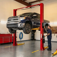 2-Post Car Lift Built for Professional Service, 12000 Lb Capacity, 70.87 Inch Height, Dual Hydraulic Drive — Lifestyle